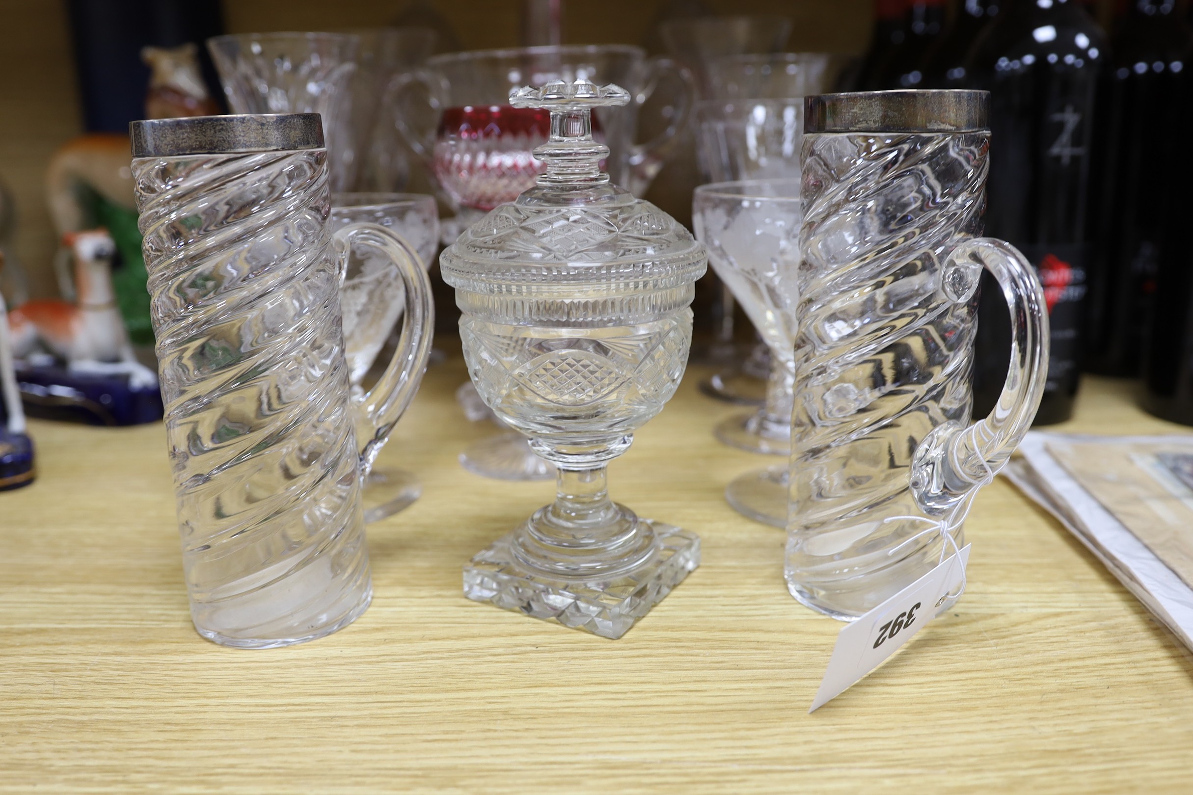 A pair of George III glass sweetmeat jars and covers, 31cm, a pair of silver-mounted tankards, Royal commemorative glassware, etc.